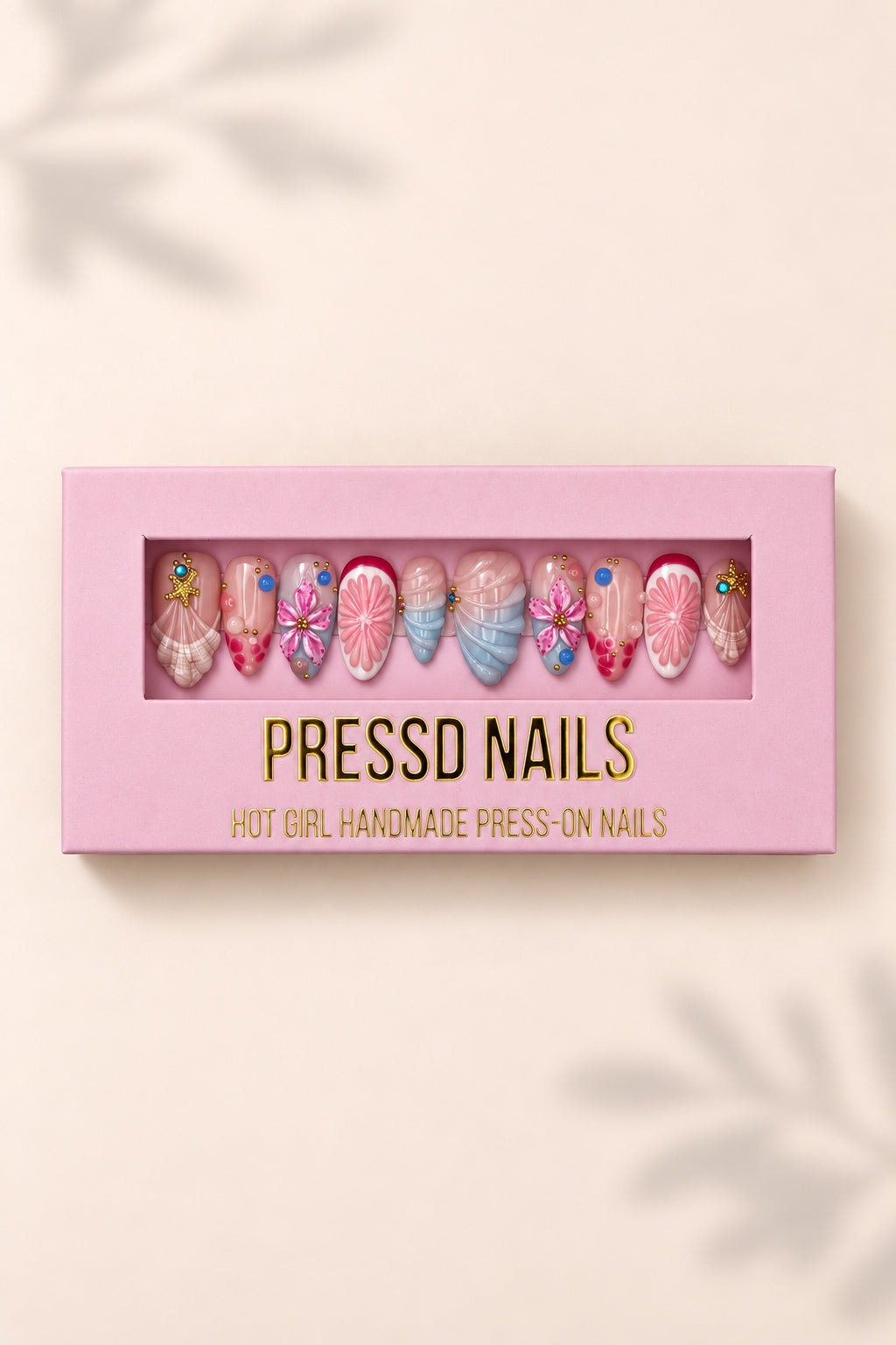 Pink Ocean nail set in its pink Pressd Nails box