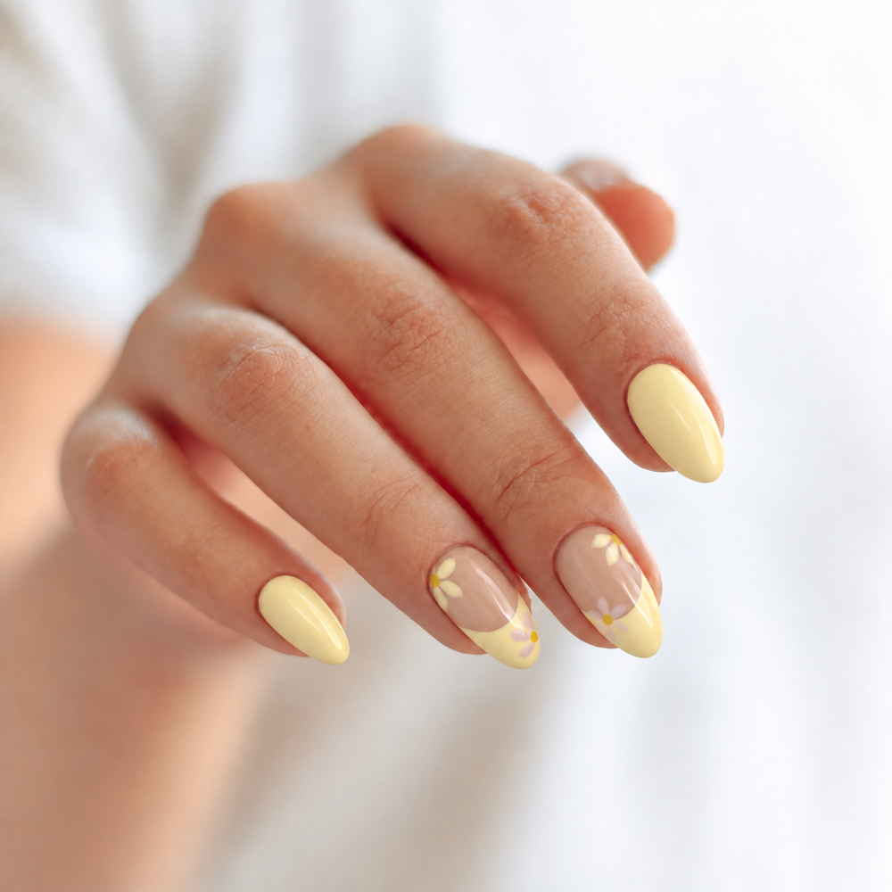 Yellow Daisy hand styling image with butter-yellow and floral French-tip nails