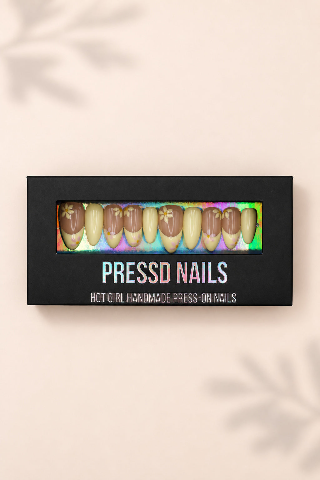 Yellow Daisy nail set in its black Pressd Nails box